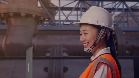 Asian Female Use Computer While Walking with Industrial Pipeline Stock Footage 318078637