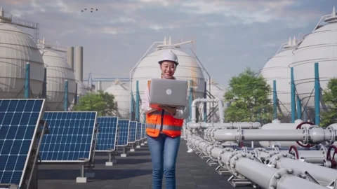 Asian Female Use Computer While Walking at Energy Complex Stock Footage 330175936