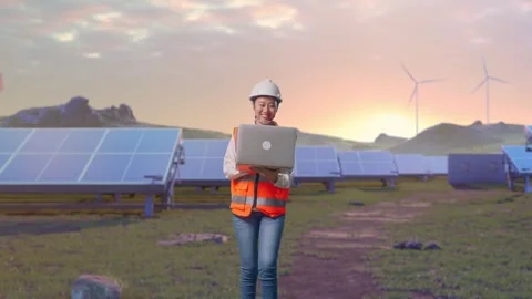 Asian Female Use Computer While Walking on Energy Farm Stock Footage 331019170