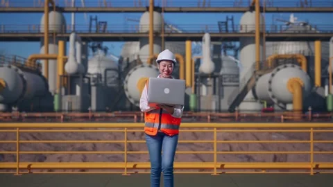 Asian Female Use Computer While Walking at Energy Plant Stock Footage 331194442