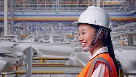 Asian Female Use Computer While Walking In Car Factory Stock Footage 331629340