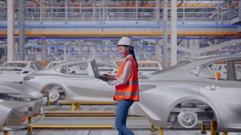 Asian Female Use Computer While Walking In Car Factory Stock Footage 331629417