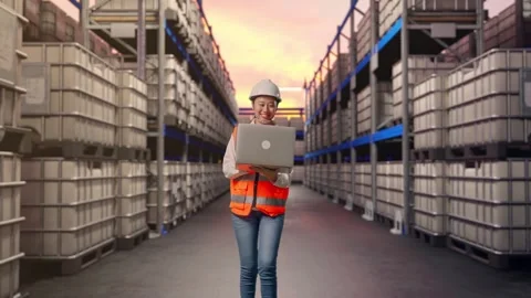 Asian Female Use Computer While Walking at Fuel Warehouse Stock Footage 332124332
