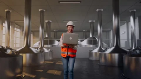 Asian Female Use Computer While Walking at Beer Plant Stock Footage 332159843