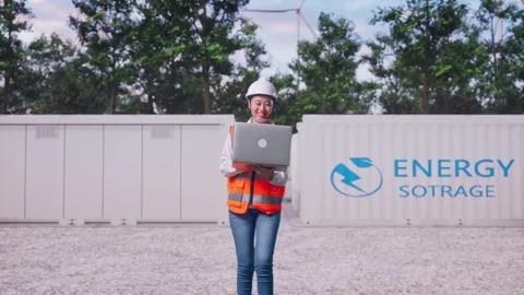 Asian Female Use Computer While Walking with Energy Storage Stock Footage 337810606