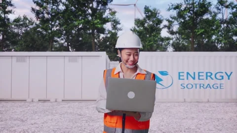 Asian Female Use Computer While Walking with Energy Storage Stock Footage 337810757