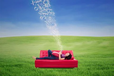 Asian female using touchpad on sofa with flying letters outdoor Stock Illustration