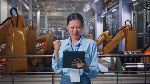 Asian Female Worker Celebrating With Tablet With Robotic Arms Stock Footage 301932091