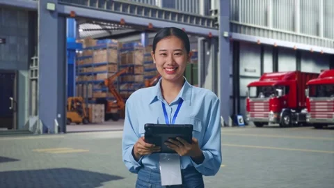 Asian Female Worker Use Tablet And Smiling To Camera , Outside Warehouse Vídeos de archivo 295128982