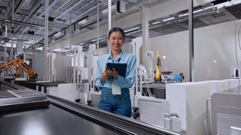 Asian Female Worker Use A Tablet And Smiling To Camera, Battery Factory Stock Footage 314933308