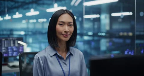 Asian Female Working on Computer in Data Center Office Stock Footage 296174444