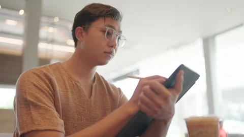 Asian freelancer co work cafe. Busy person use computer macbook coworking place. Stock Footage 251973975