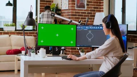 Asian freelancer developer working with headphones and chroma key screen Foto stock