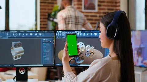 Asian freelancer developer working with headphones and chroma key screen Foto stock