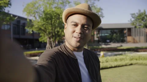 Asian freelancer put on brown hat working outdoor. Office worker or businessman  Video stock 144519041
