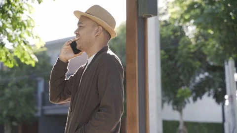 Asian freelancer put on brown hat working outdoor. Office worker or businessman  Stock-Footage 144519115