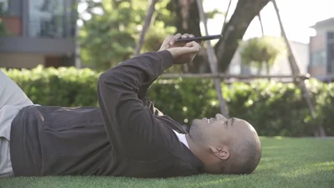 Asian freelancer put on brown hat working outdoor. Office worker or businessman  Stock Footage 144519146