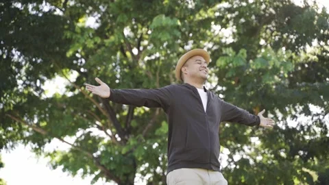 Asian freelancer put on brown hat and working outdoor. Office worker or business Stock Footage 144519360