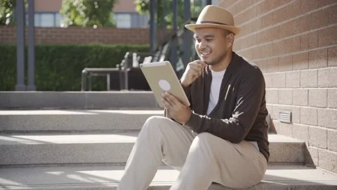 Asian freelancer put on brown hat working outdoor. Office worker or businessman  Stock Footage 144519851