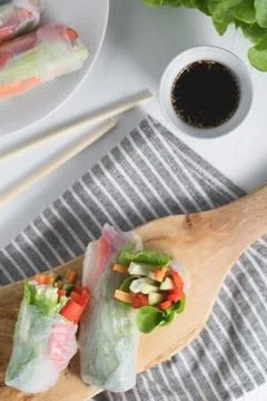 Asian fresh spring rolls. Raw cucumber, carrot, lettuce, bell pepper, tofu ch Stock Photos
