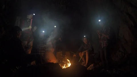 Asian friend groups having fun camping in cave. Video stock 121047259