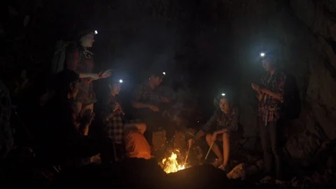 Asian friend groups having fun camping in cave. Video stock 121047294