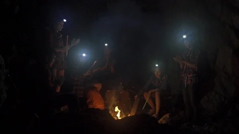 Asian friend groups having fun camping in cave. Video stock 121047385