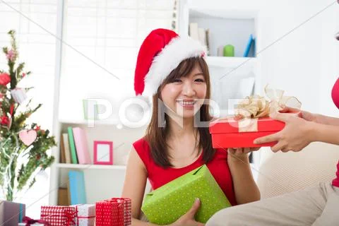 Asian friends christmas celebration , chinese south east asian ethnicity Stock Photos