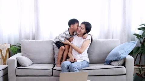 Asian funny son teasing mom and kissing her cheek, Adorable little boy give.. Stock Footage 244044111