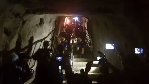 Asian Games torch passes through Japanese wartime tunnel in Indonesia Stock Footage 106314717