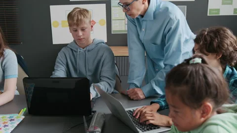 Asian Girl Completing her Assignment on Laptop During Programming Lesson Stock Footage 317640784