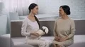 Asian girl giving present to mother, celebrating anniversary of marriage, family 4k or 4k+ Resolution
