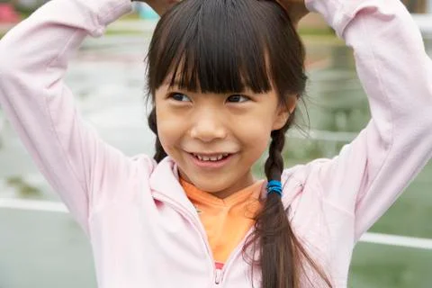 Asian girl with hands on head Stock Photos