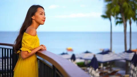 Asian girl standing on outdoor terrace w... | Stock Video | Pond5