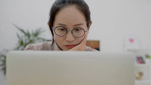 Asian girl using computer laptop working at home office. Stock Footage 87487578
