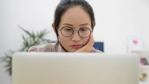 Asian girl using computer laptop working at home office. Stock Footage 87487798
