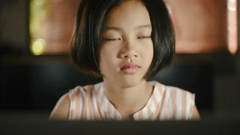 Asian girl using computer laptop at home for education. Stock Footage 99890637