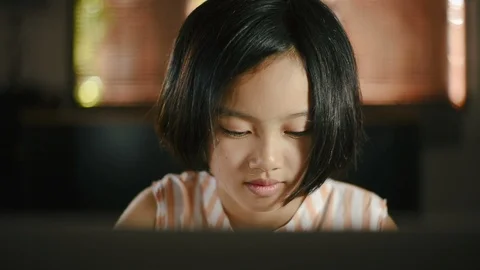 Asian girl using computer laptop at home for education. Stock Footage 99890832