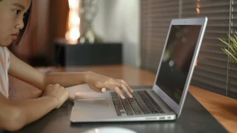 Asian girl using computer laptop at home for education. Stock Footage 99945183