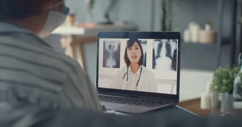 Asian girl using computer laptop talk in video conference with doctor. Stock Footage 154214871