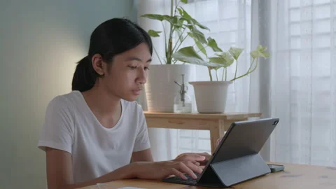 Asian  girl using tablet digital at home, Asia women typing work Stock Footage 163517203