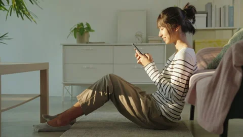 Asian girl using texting smartphone or chat. Stock Footage 238511552