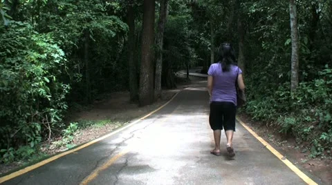 Asian Girl Walking Down Path In Forest 스톡 동영상 11132665