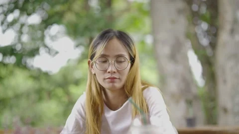 Asian girl ware mask protect virus using smartphone in cafe texting sharing mess Stock Footage 198297779