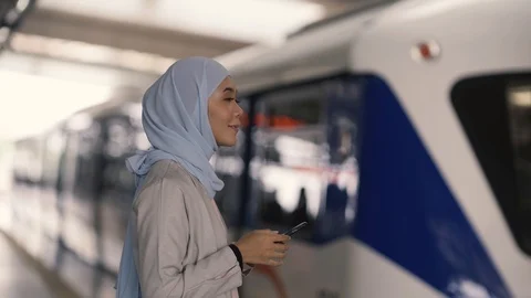 Asian group waiting train to arrive in station Video stock 105273598