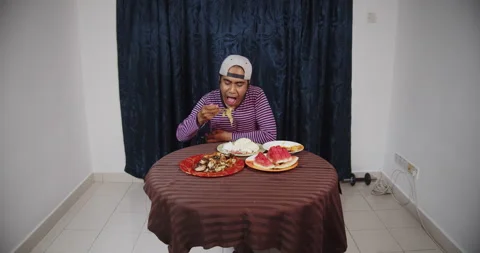 Asian guy dinner alone Stock Footage 141207433