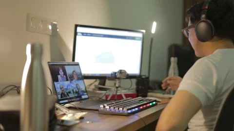 Asian guy does international video conference Stock Footage 128430609