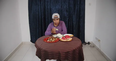 Asian guy eating raw cabbage Video stock 141213699