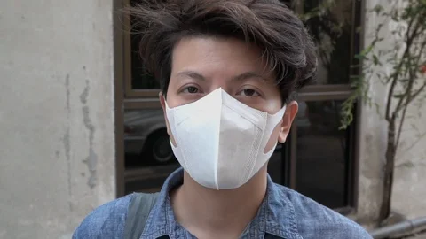 Asian guy getting screening by Thermometer gun Stock Footage 126951703