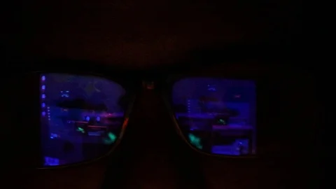 Asian guy involved in malicious activity in a dark room. Cybercrime Video stock 113074669